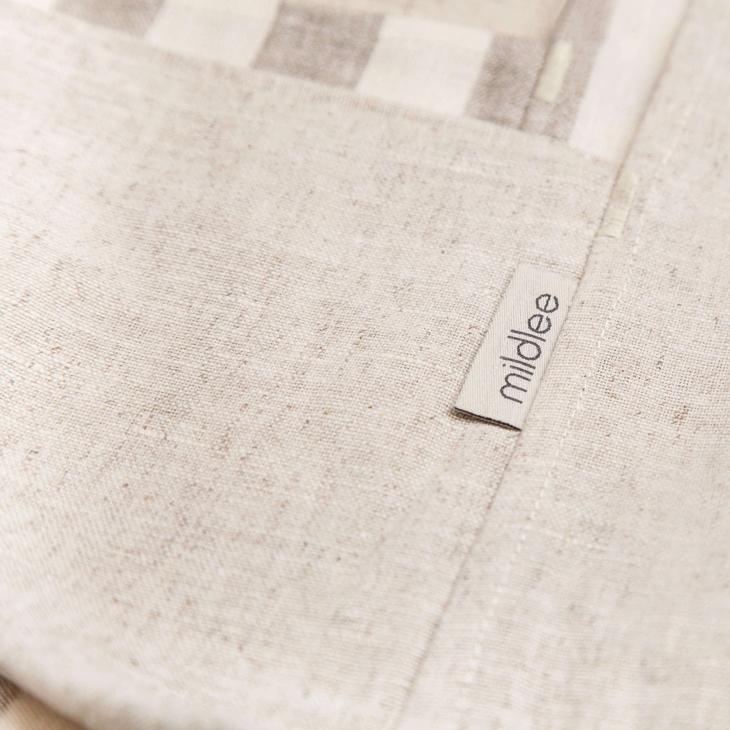 A Fragment of the Linen Bag Made from 100% Undyed, Unbleached Linen of Natural Color with the Branded Tag "Mildlee"