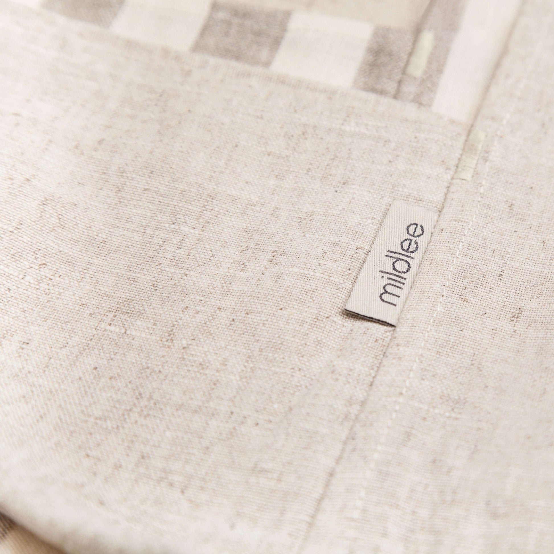 A Fragment of the Linen Bag Made from 100% Undyed, Unbleached Linen of Natural Color with the Branded Tag "Mildlee"